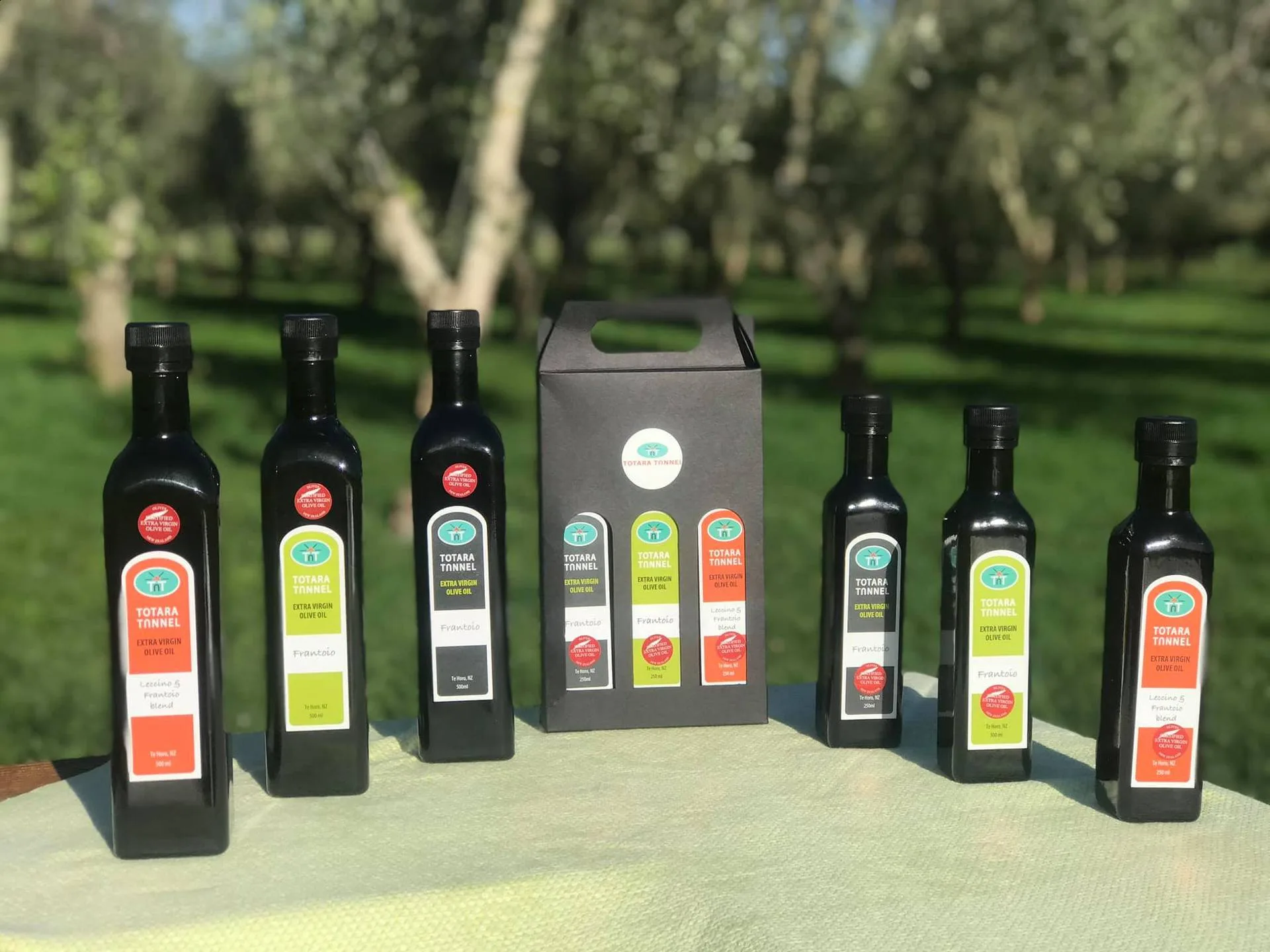 Totara Tunnel Grove Blend bottles with orange Leccino and Frantoio blend labels